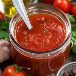 Tomato,Sauce,In,A,Glass,Jar,And,Ingredients,,Vertical,,Closeup,