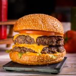 Angus,Beef,Double,Burger,Isolated,On,Cutting,Board,Top,View